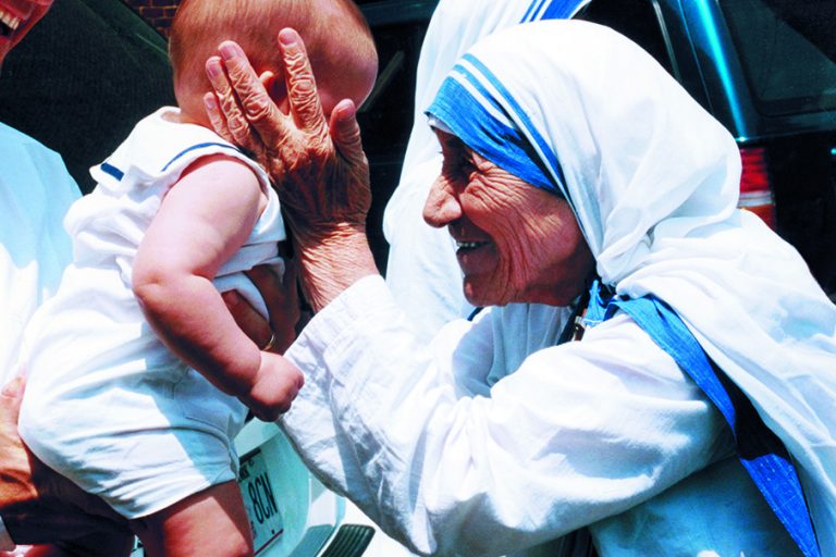 Mother Teresa Holding Baby