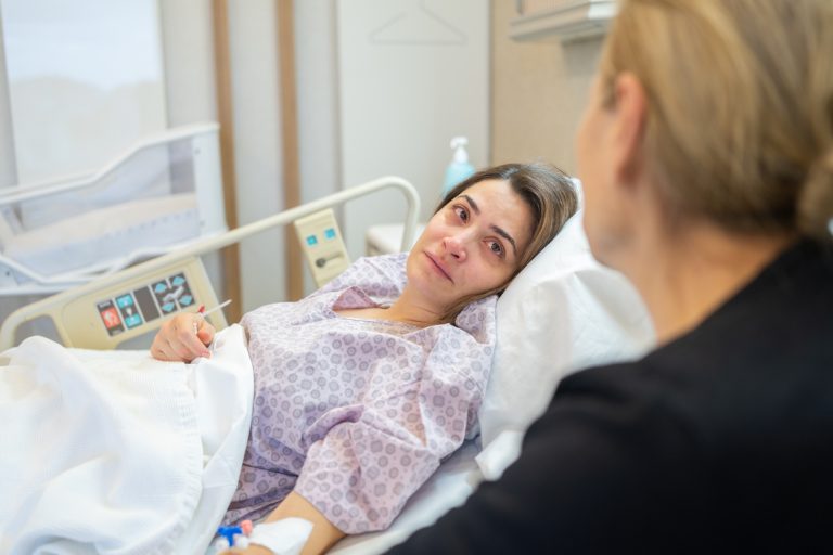 Female Patient Looking At Her Mother İn Hospital Bed