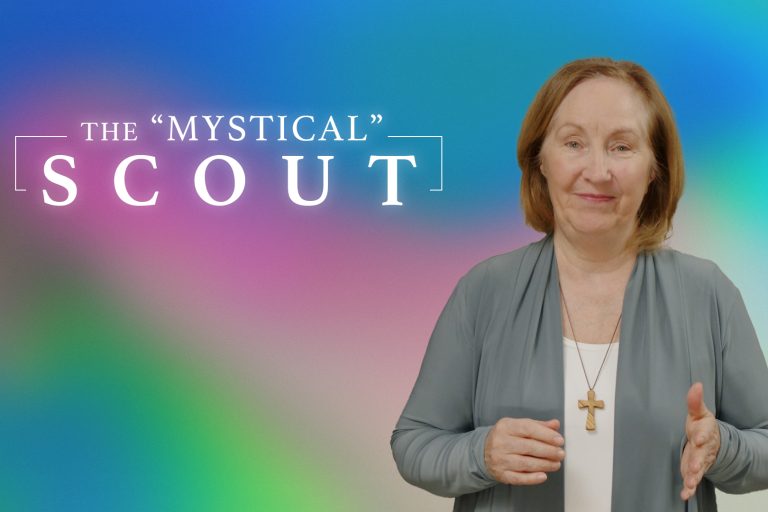 Older woman, Kathy Clarke, with green sweater and white t-shirt, with a wooden cross on a necklace. Title reads "The Mystical Scout"