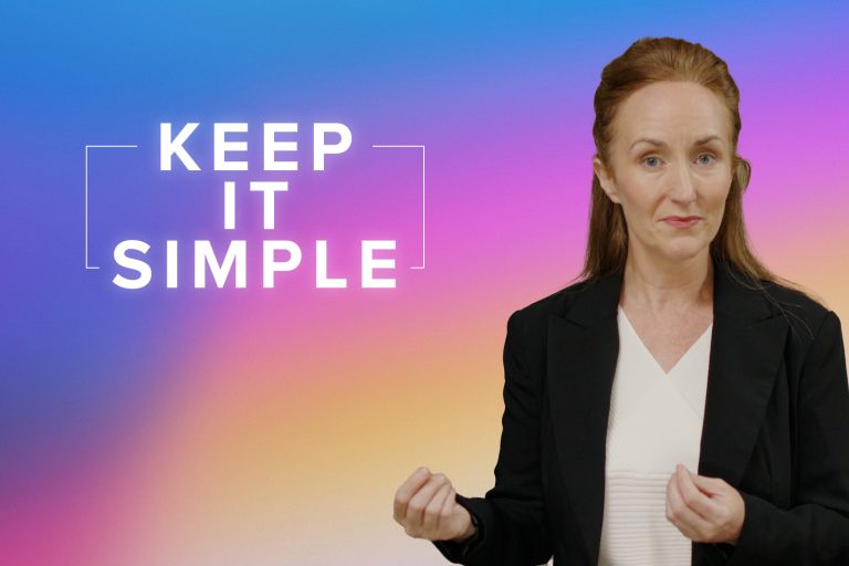 Woman (Margaret McGahon) in white shirt and black jacket. background is blue that fades into pink and then orange. Caption reads "Keep it simple"